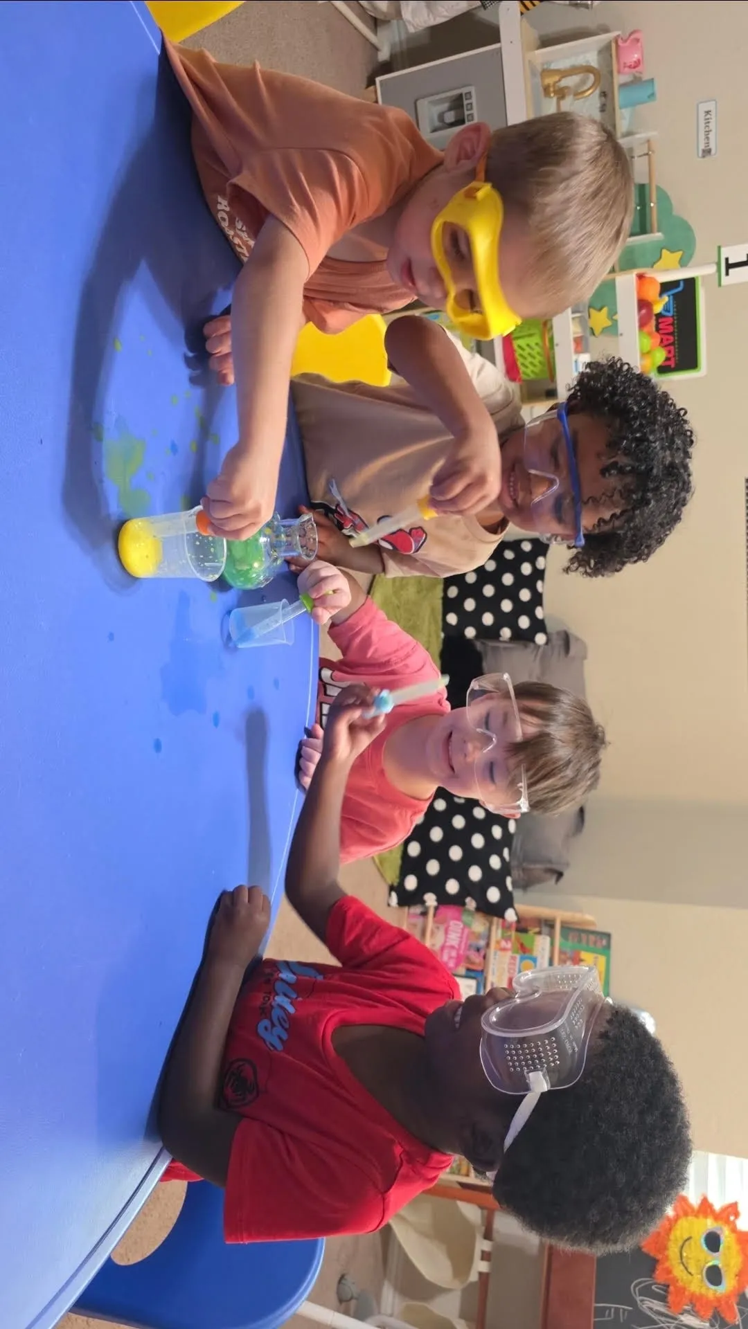 A child happily engaged in a classroom activity